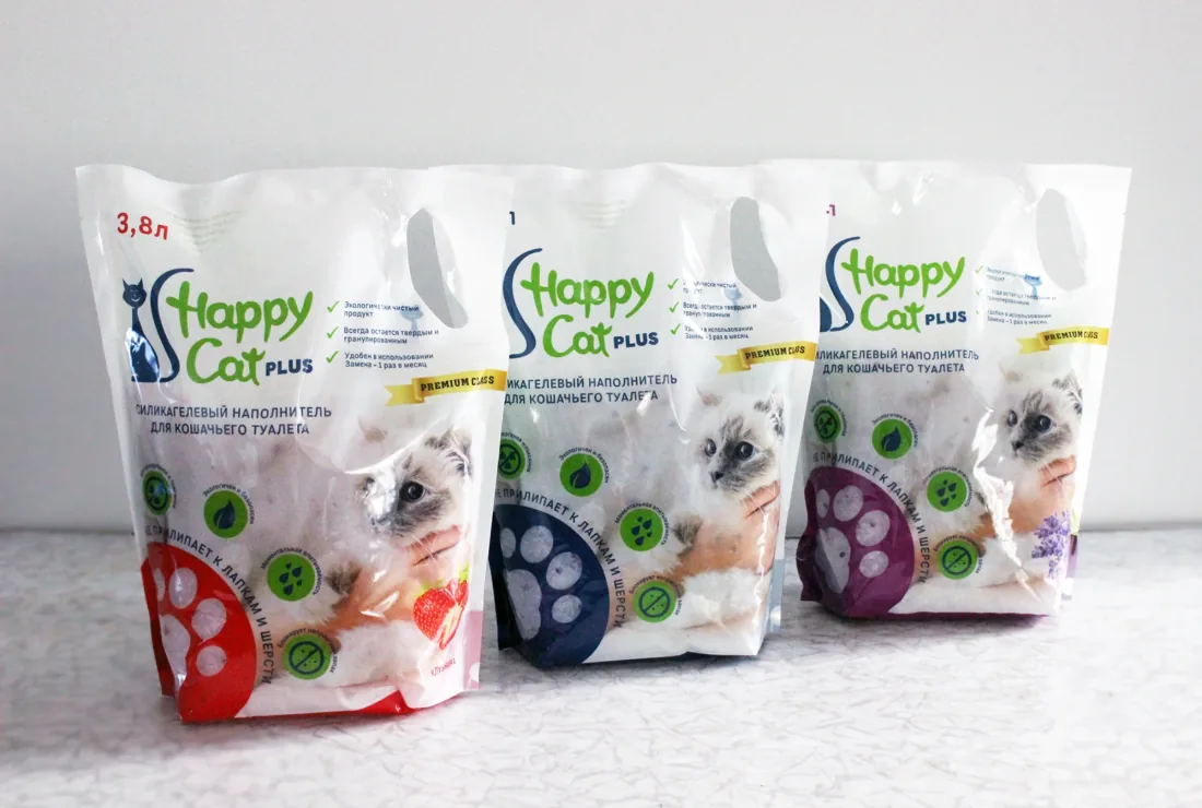 Three scent variants of Happy Cat Plus on a shelf