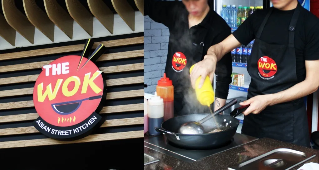 The Wok signage and staff uniforms in store